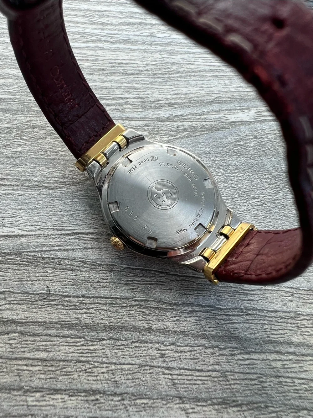 Seiko SQ 50 Silver and Gold Case Watch with White Dial and Leather Strap